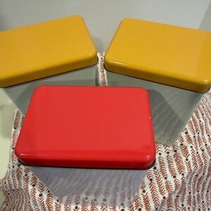 Hay Tin containers by Snowden designed in Denmark set of 3 2 yellow and one pink